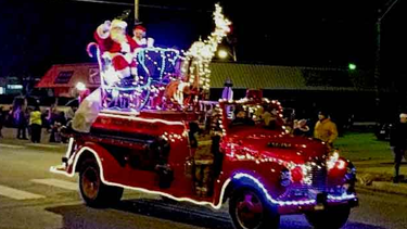 Santa in lighted firetruck