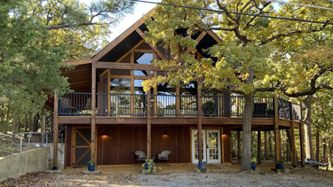 Engaging Texoma tri-story home in the trees with space for all personalities!